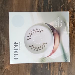 New, in box. Never opened (in sealed box) Core by Hyperice smart meditation.